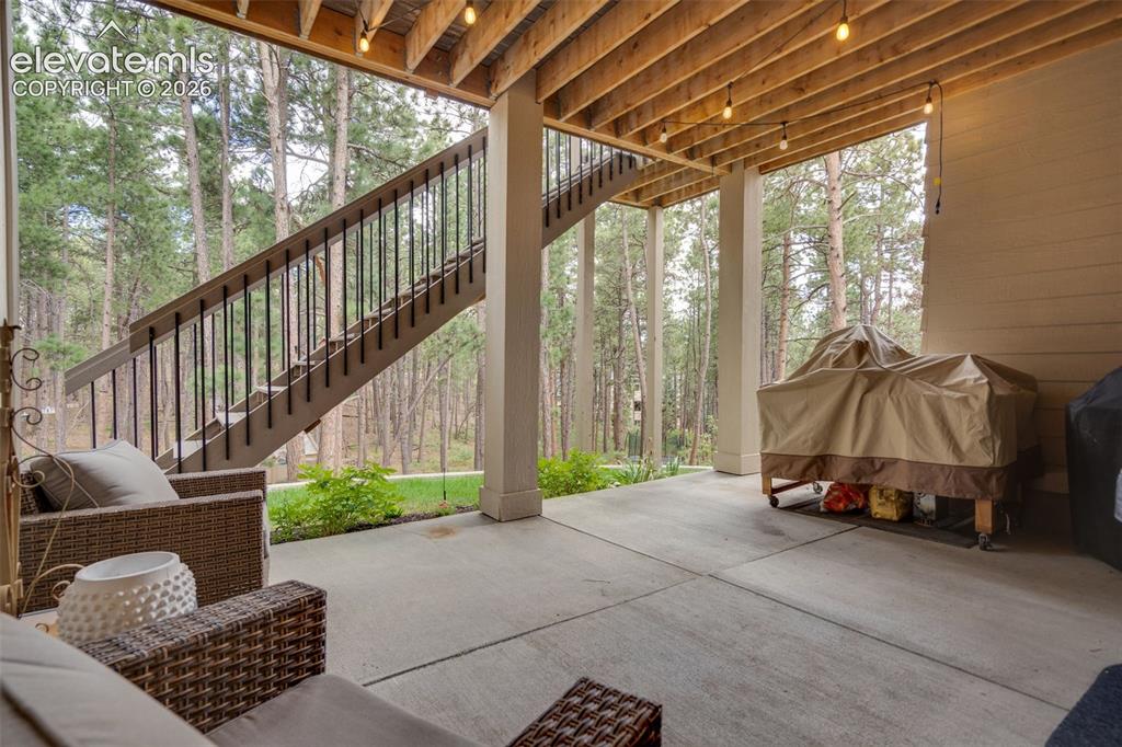 Image 42 of 48: Walk-out covered patio