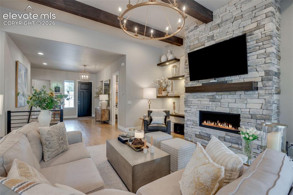 Image 8 of 48: Floor to ceiling stone fireplace
