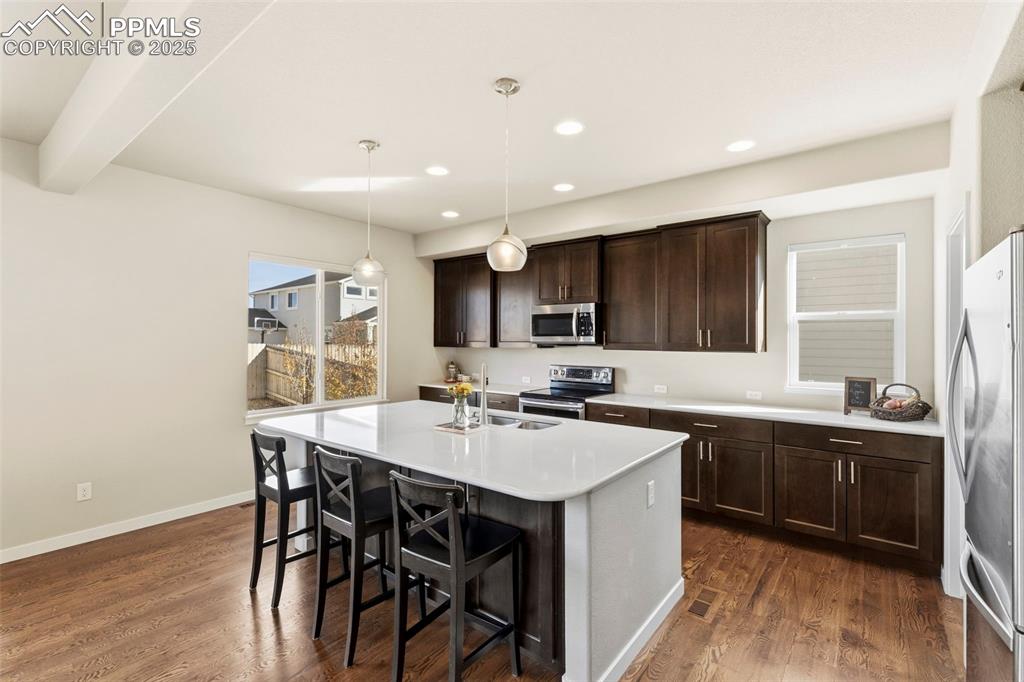 Image 10 of 40: Large Island and lots of Quartz Counterspace.