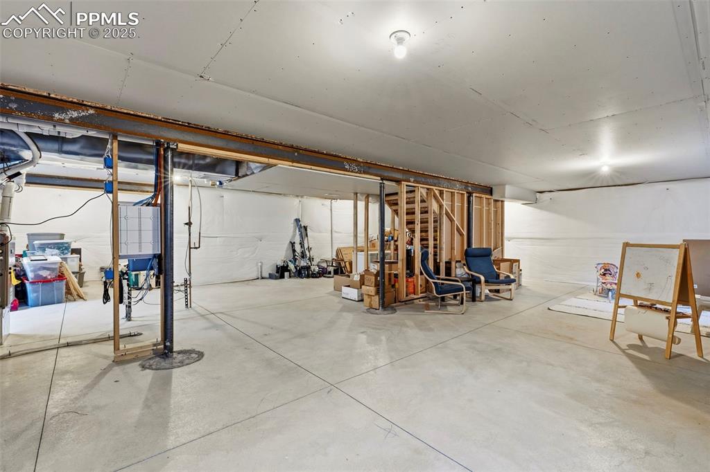 Image 32 of 40: Great layout potential with bedrooms, family room, and storage.