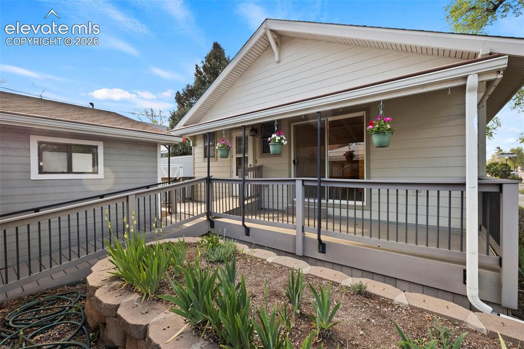 Image 37 of 44: Front exterior featuring siding, covered porch, sliding glass door, and ext