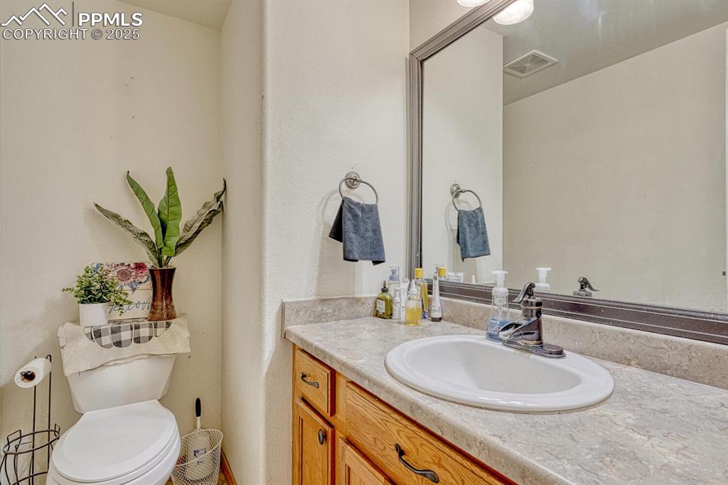 Image 13 of 47: Main level bathroom