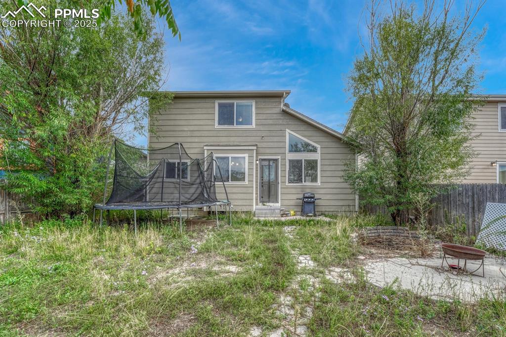 Image 37 of 47: Fenced back yard