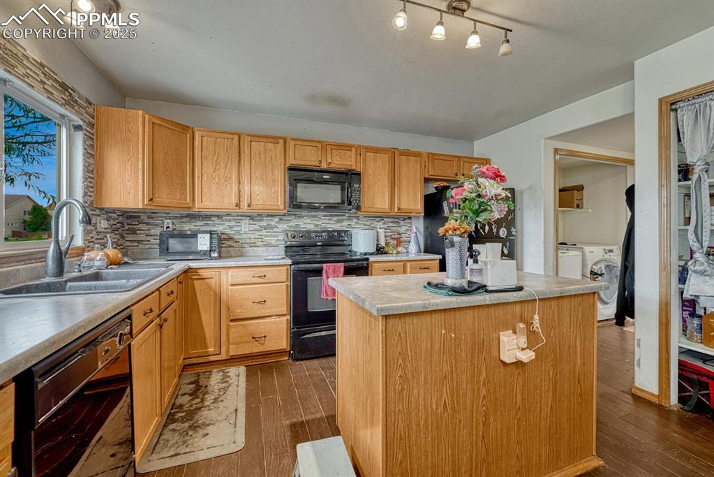 Image 9 of 47: Kitchen with island and pantry