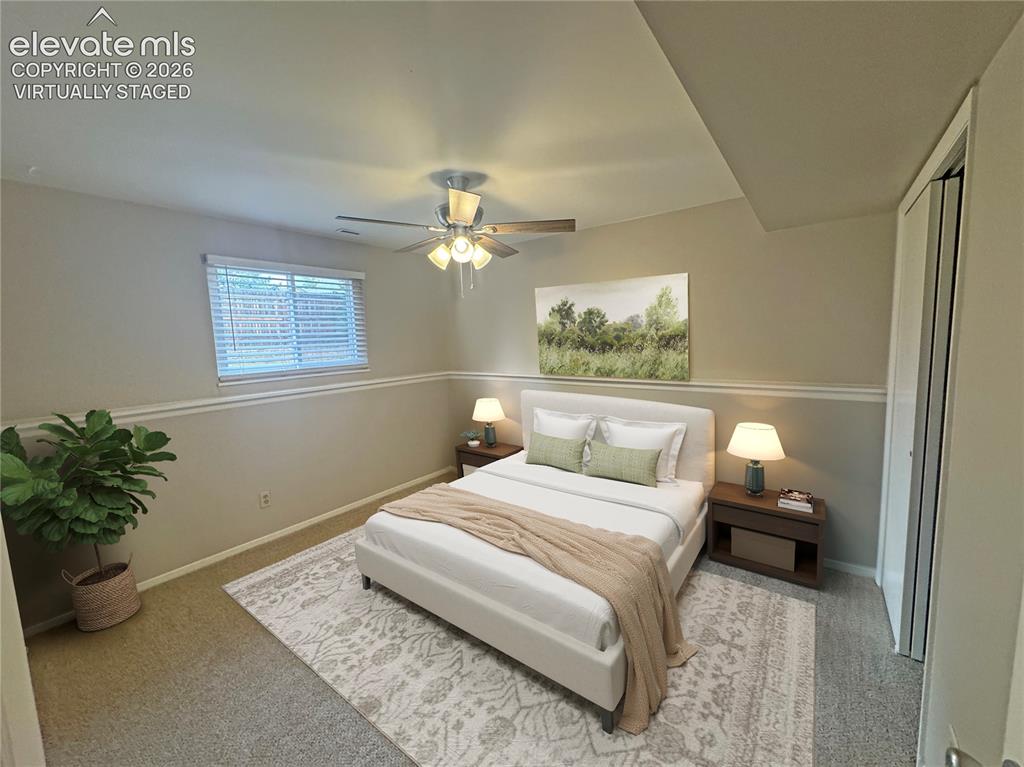 Image 23 of 42: virtually staged Neutral-toned room featuring horizontal chair rail molding