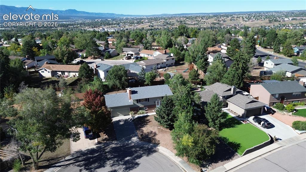 Image 3 of 42: Aerial perspective of a residential property featuring an attached two-car