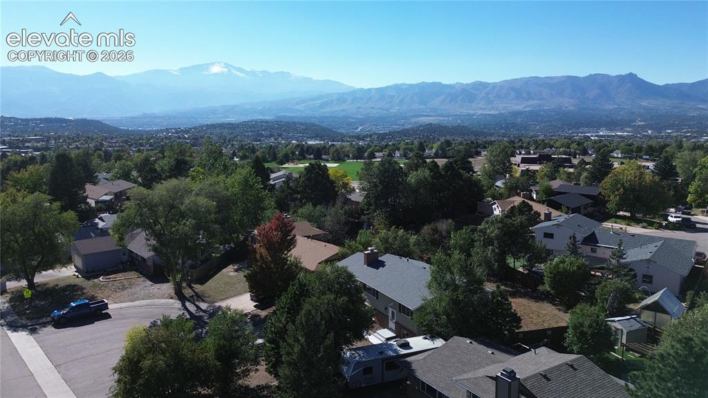 Image 4 of 42: Aerial perspective featuring expansive mountain scenery and established mat