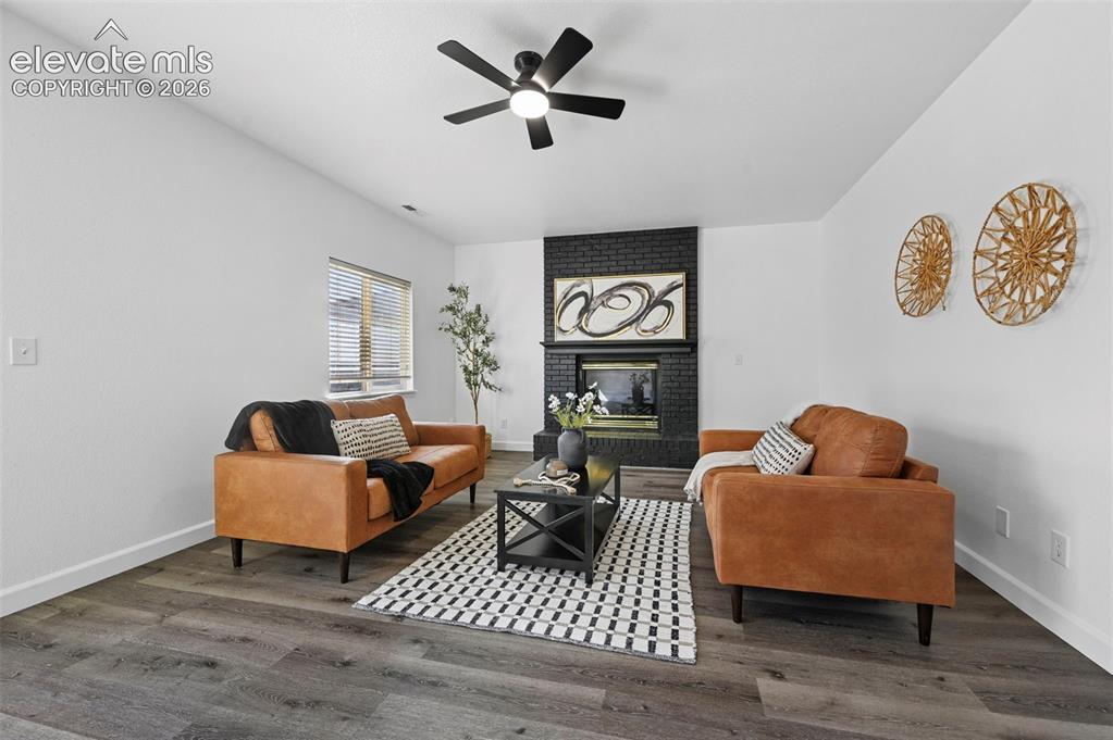 Image 24 of 36: lower level family room with fireplace