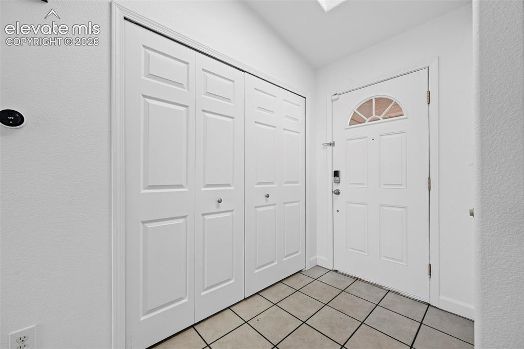 Image 4 of 36: large entry way with closet