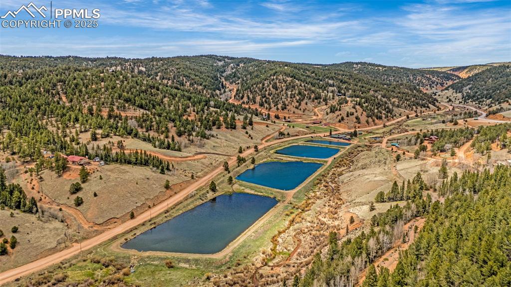 Image 32 of 45: View of property location featuring a water and mountain view and a heavily
