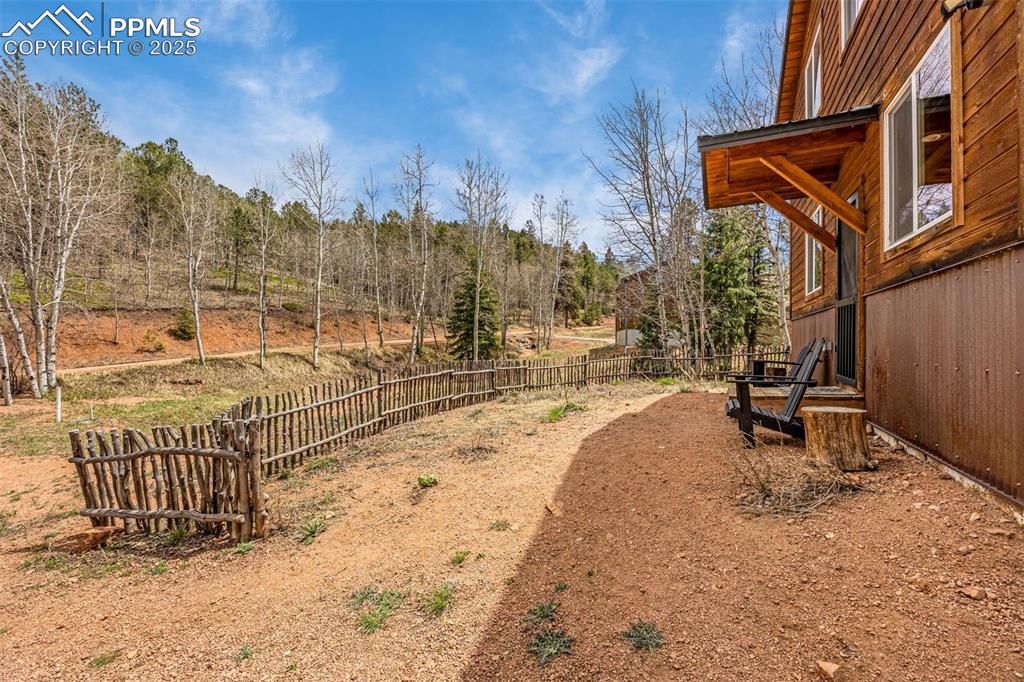 Image 5 of 45: View of fenced backyard
