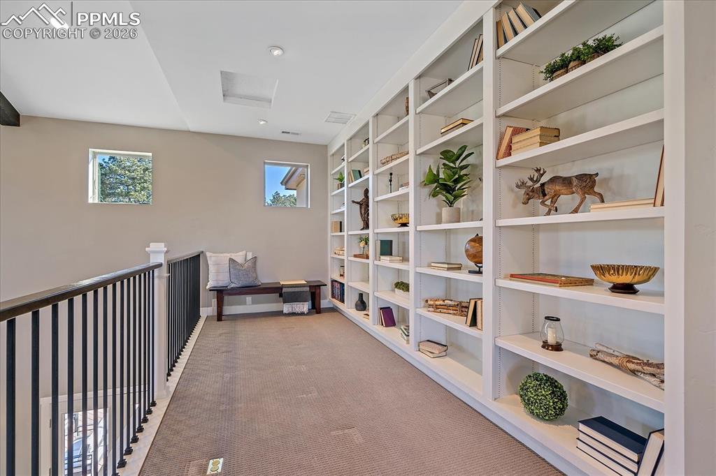 Image 26 of 50: Beautiful library loft filled with natural light 