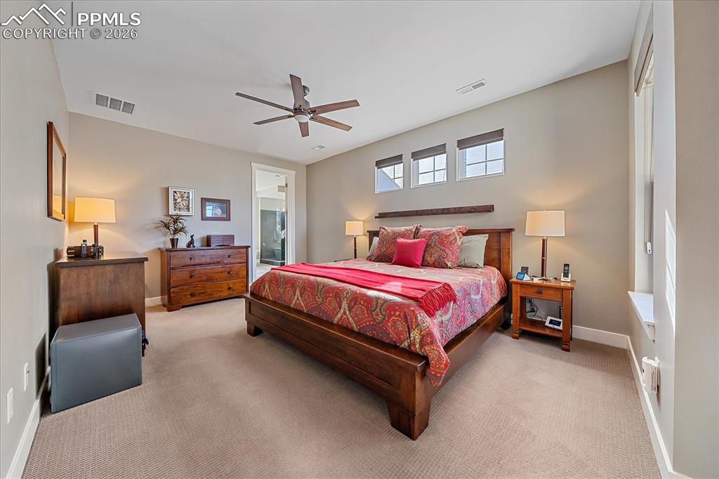 Image 27 of 50: The spacious primary bedroom offers a spa ensuite bathroom 