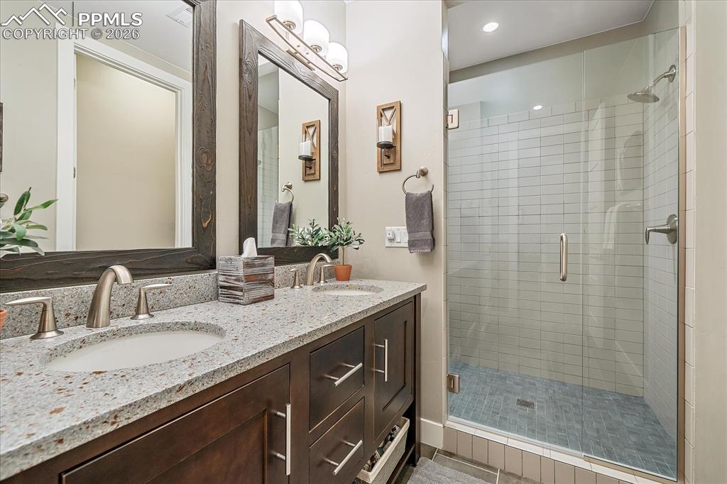 Image 36 of 50: Basement 3/4 guest bathroom