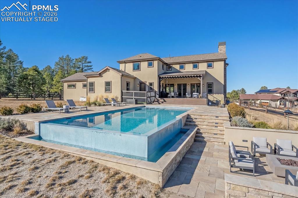 Image 42 of 50: Virtually Staged Pool and Landscaping