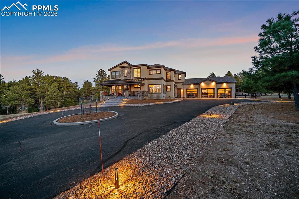 Image 49 of 50: Landscape lighting welcomes you home 