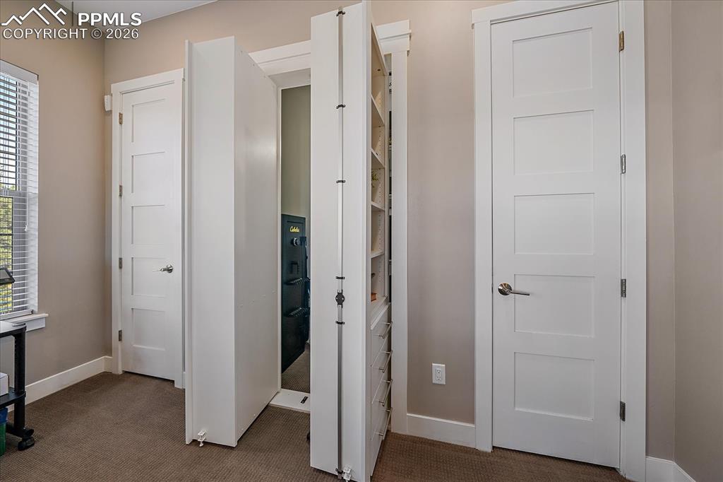 Image 8 of 50: A hidden Murphy door storage closet that can be locked for valuables or imp