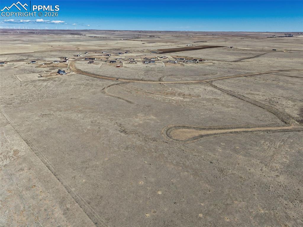 Image 5 of 10: Aerial View – Community Perspective – Elevated aerial highlighting the lot’