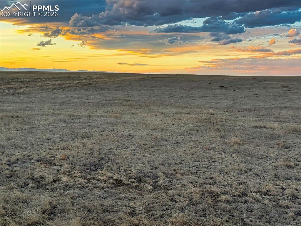 Image 8 of 10: prairie with dramatic skies creating a picturesque backdrop.