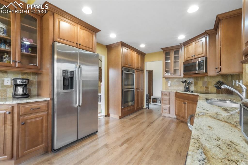 Image 11 of 50: Granite counters, updated stainless steel appliances, double oven, large ea