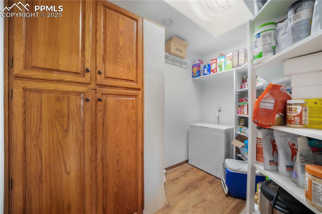 Image 13 of 50: Large walk in pantry off of kitchen