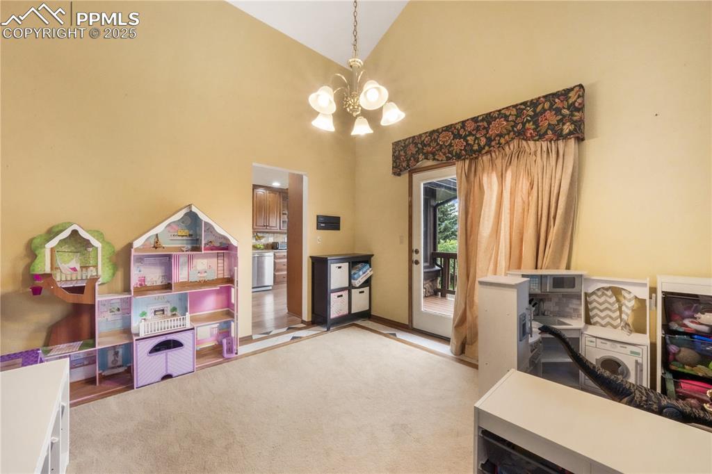 Image 14 of 50: Formal dining room with side deck access