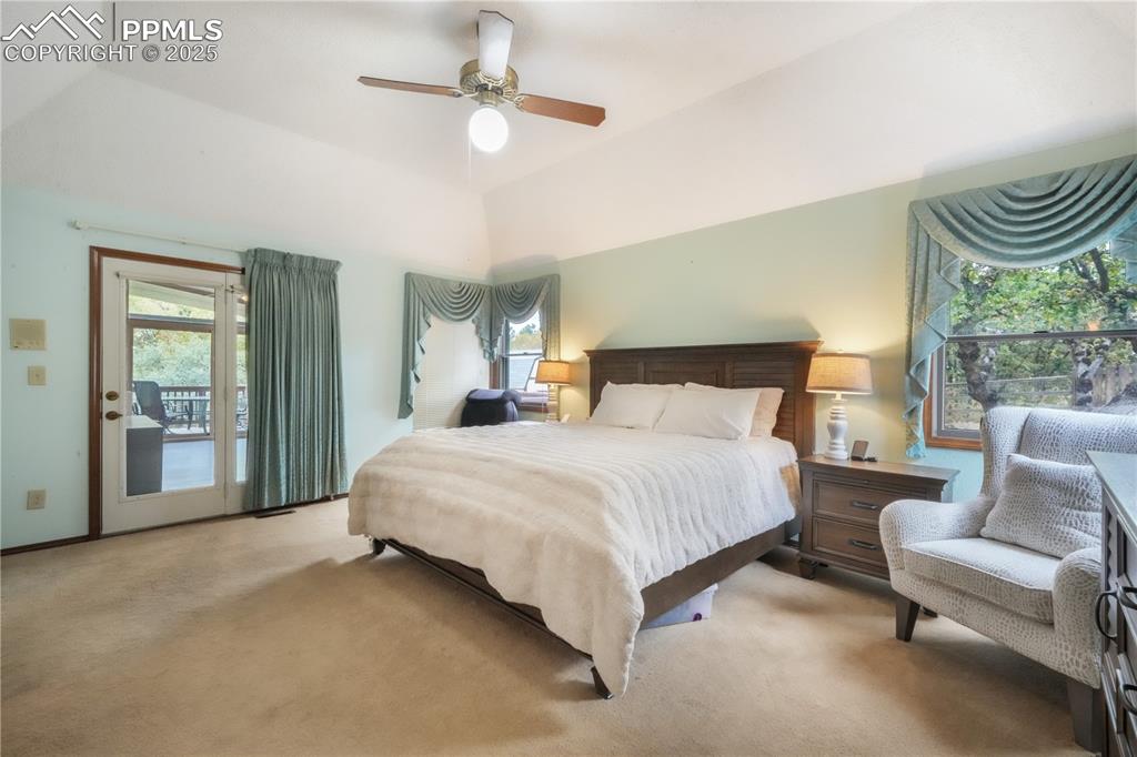 Image 20 of 50: Main level primary bedroom with ensuite bath, large walk in closet and acce