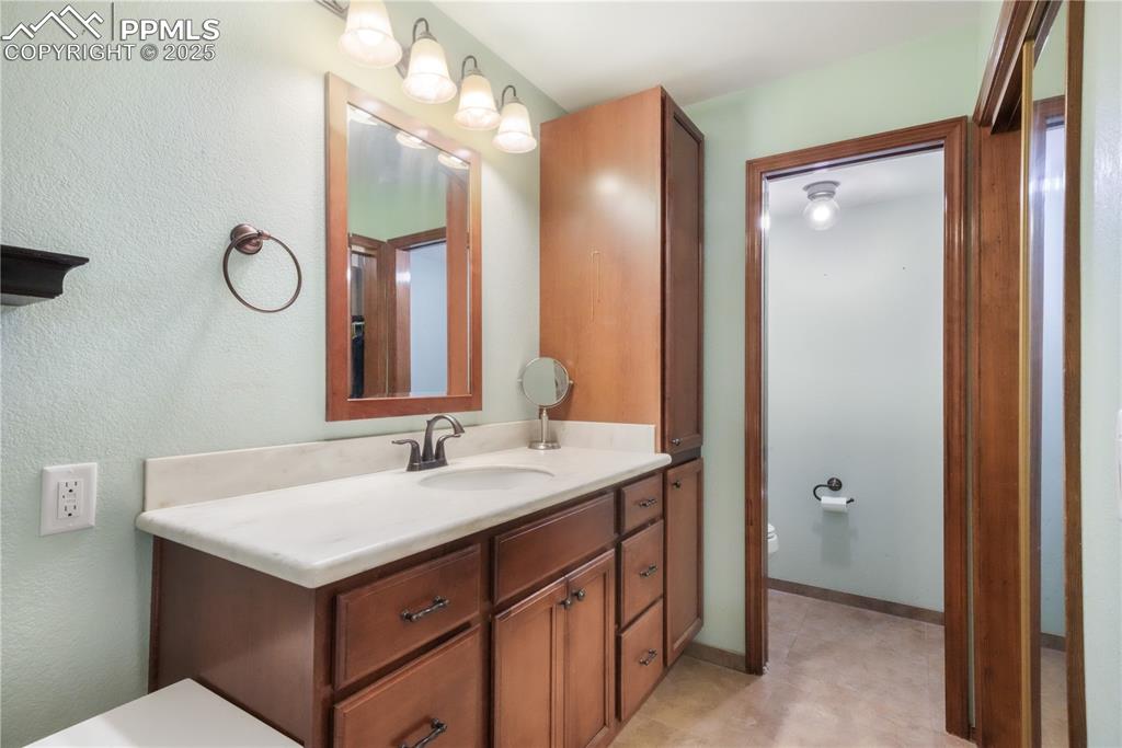 Image 24 of 50: Primary bathroom, dual vanities, private water closet, expansive walk in sh