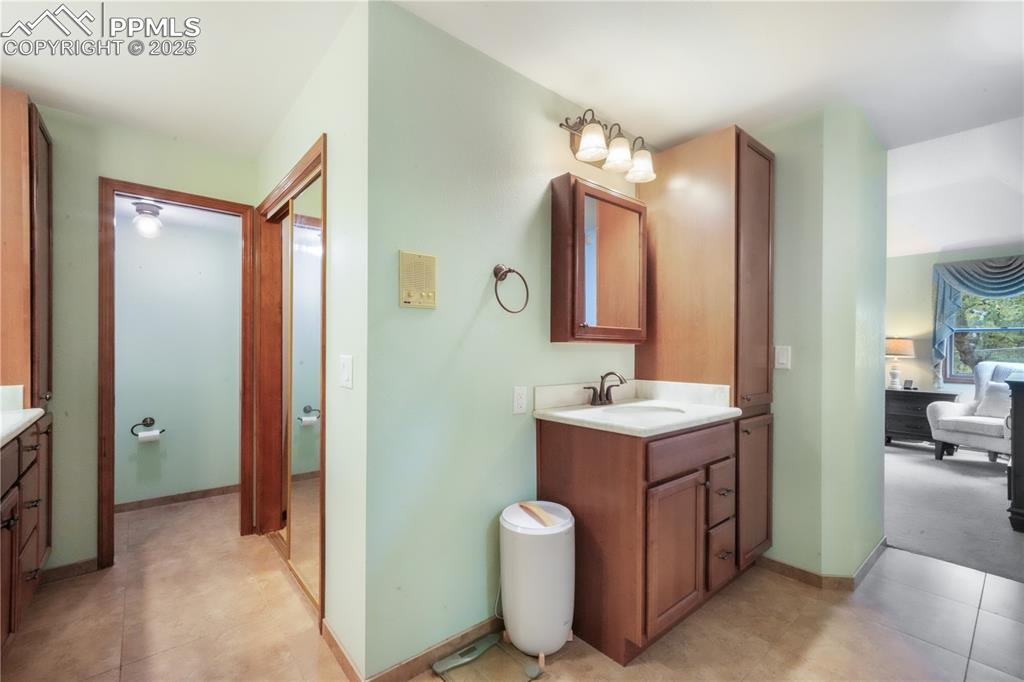 Image 25 of 50: Primary bathroom, dual vanities, private water closet, expansive walk in sh