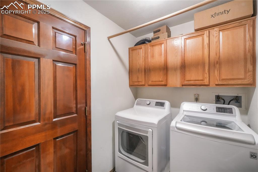 Image 27 of 50: Main level laundry room with access to garage