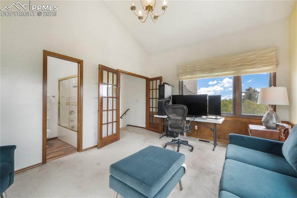 Image 34 of 50: Upper level office/flex room with mountain views and access to full bathroo