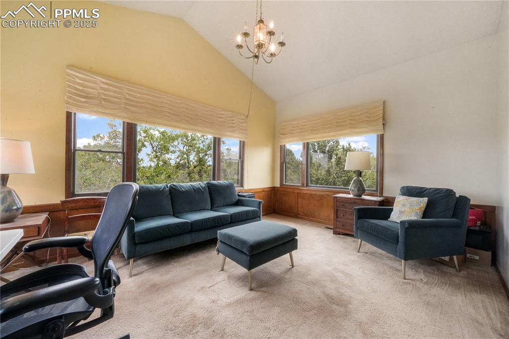 Image 36 of 50: Upper level office/flex room with mountain views and access to full bathroo