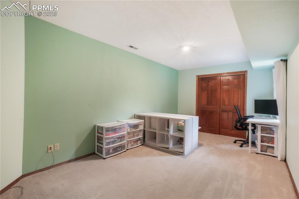 Image 42 of 50: Basement level 4th bedroom with full light window
