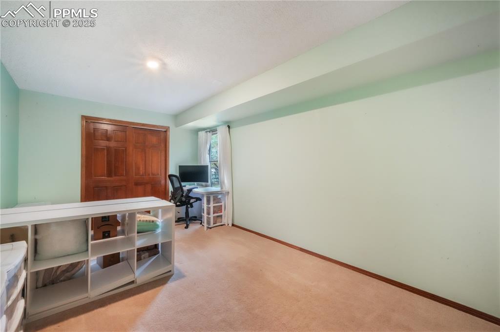 Image 43 of 50: Basement level 4th bedroom with full light window