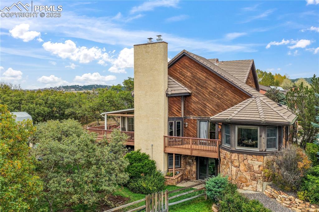Image 47 of 50: Back/side of yard, lots of mature landscaping and privacy