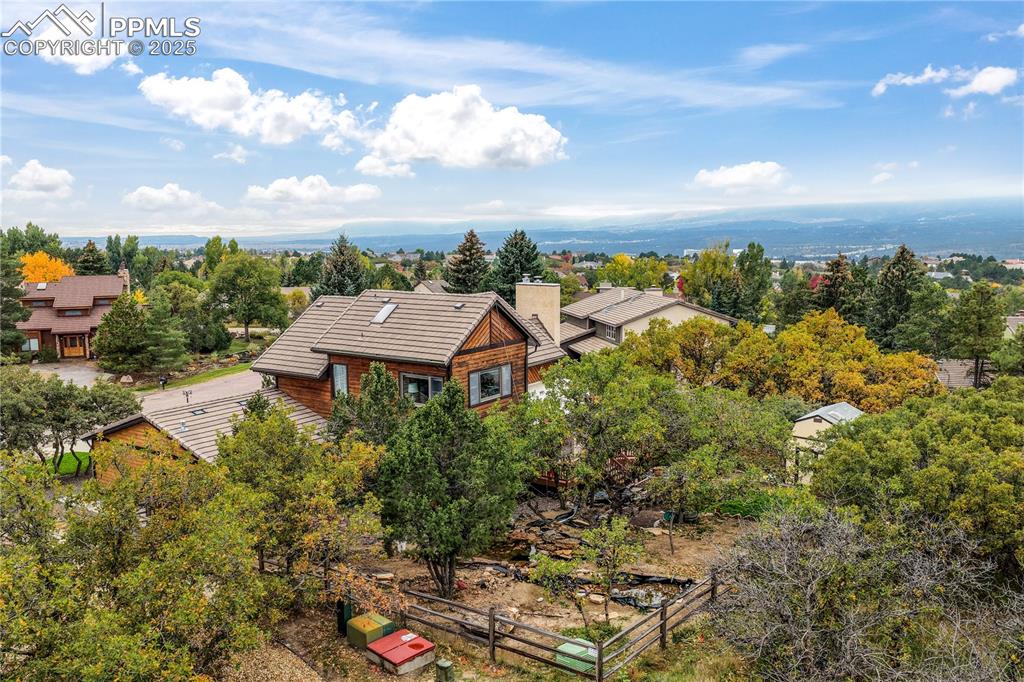 Image 48 of 50: Back/side of yard, lots of mature landscaping and privacy