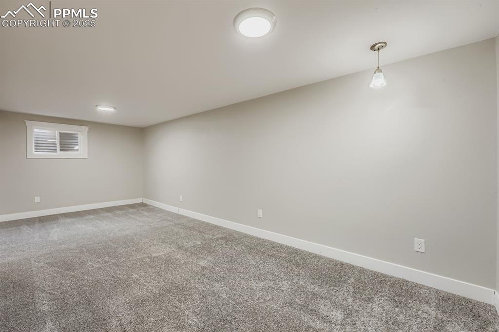 Image 19 of 28: Recreation room with new carpet!