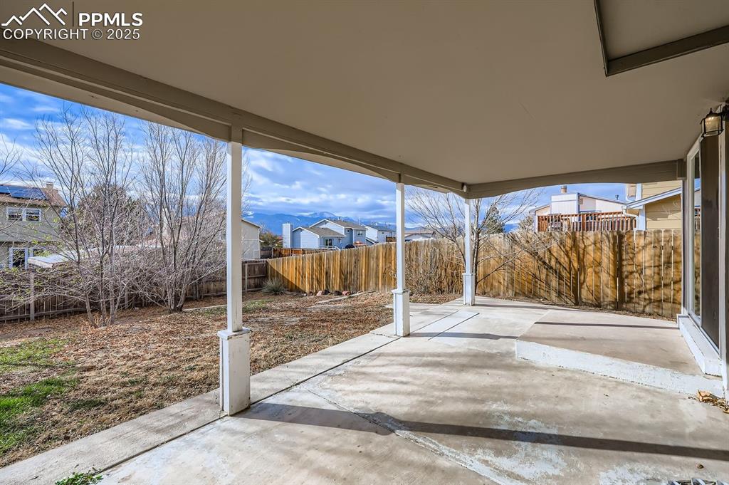 Image 27 of 28: Nice covered patio with  lovely mountain views!