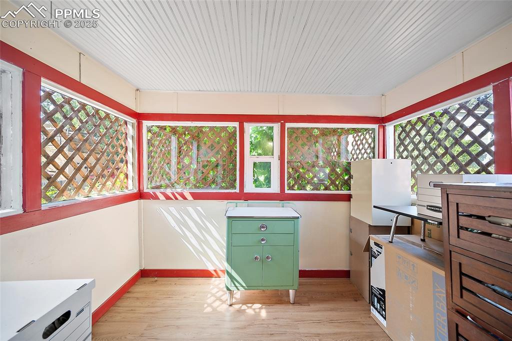 Image 25 of 39: Sunroom off bedroom