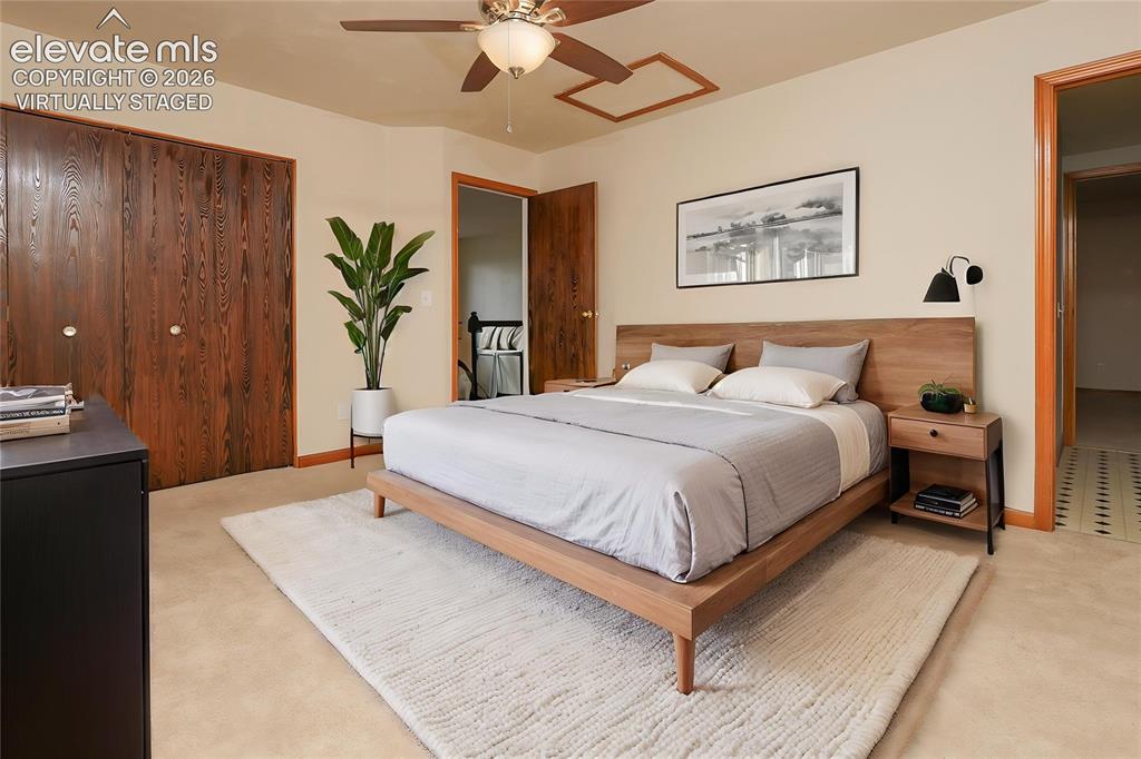 Image 15 of 32: Neutral-toned walls complement wood-finish trim and doors Virtually Staged