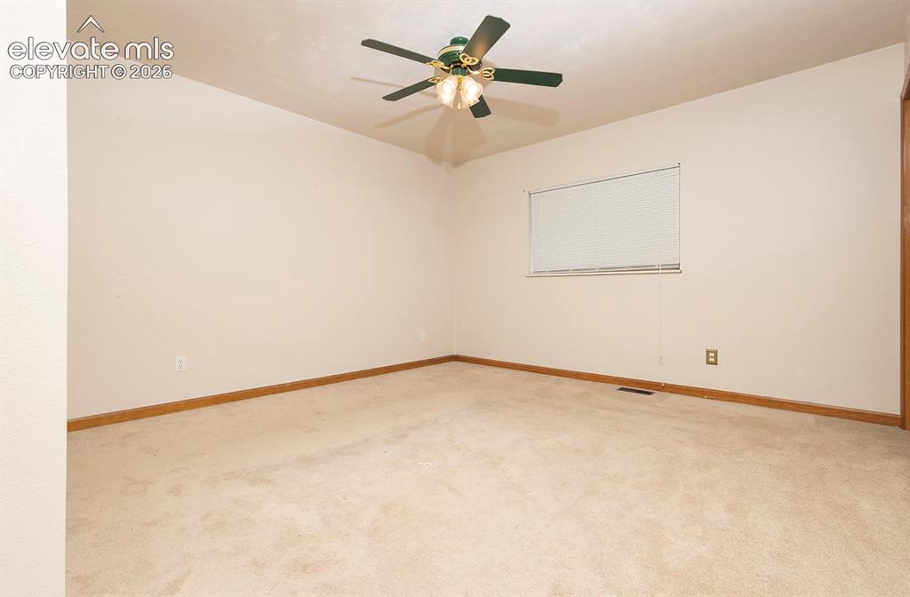 Image 31 of 32: Room featuring neutral carpeting and light-toned walls