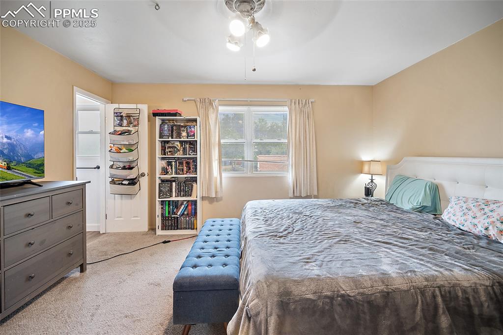 Image 16 of 49: Bedroom with carpet and ceiling fan
