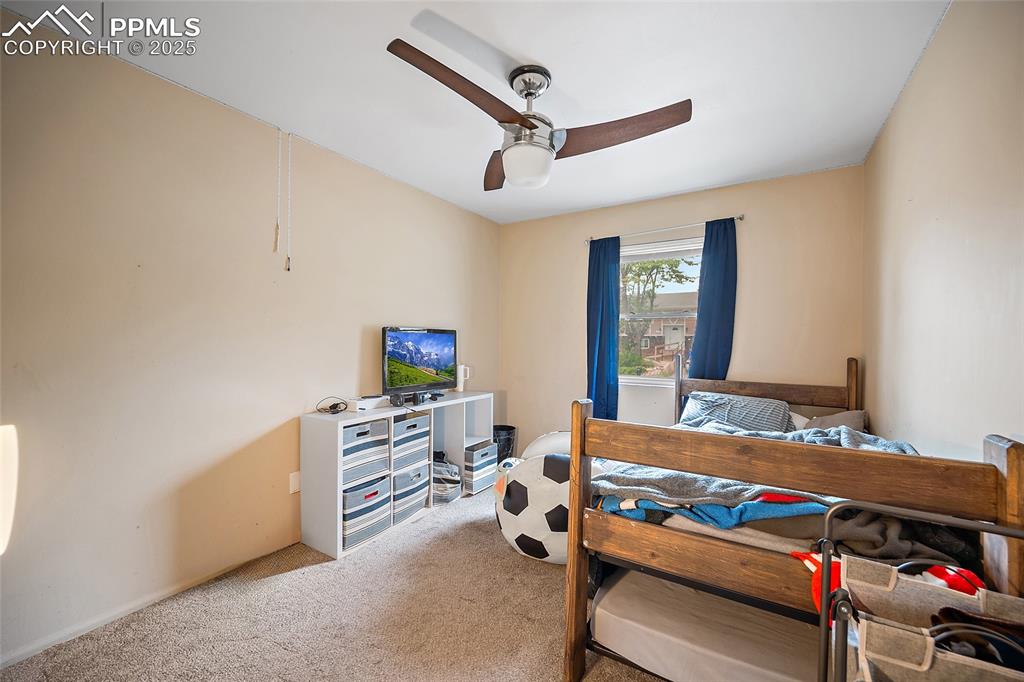 Image 21 of 49: Bedroom featuring carpet and a ceiling fan
