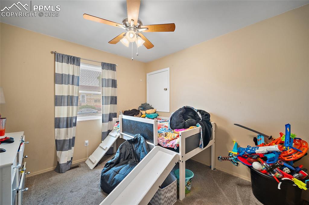 Image 22 of 49: Bedroom featuring carpet floors and a ceiling fan