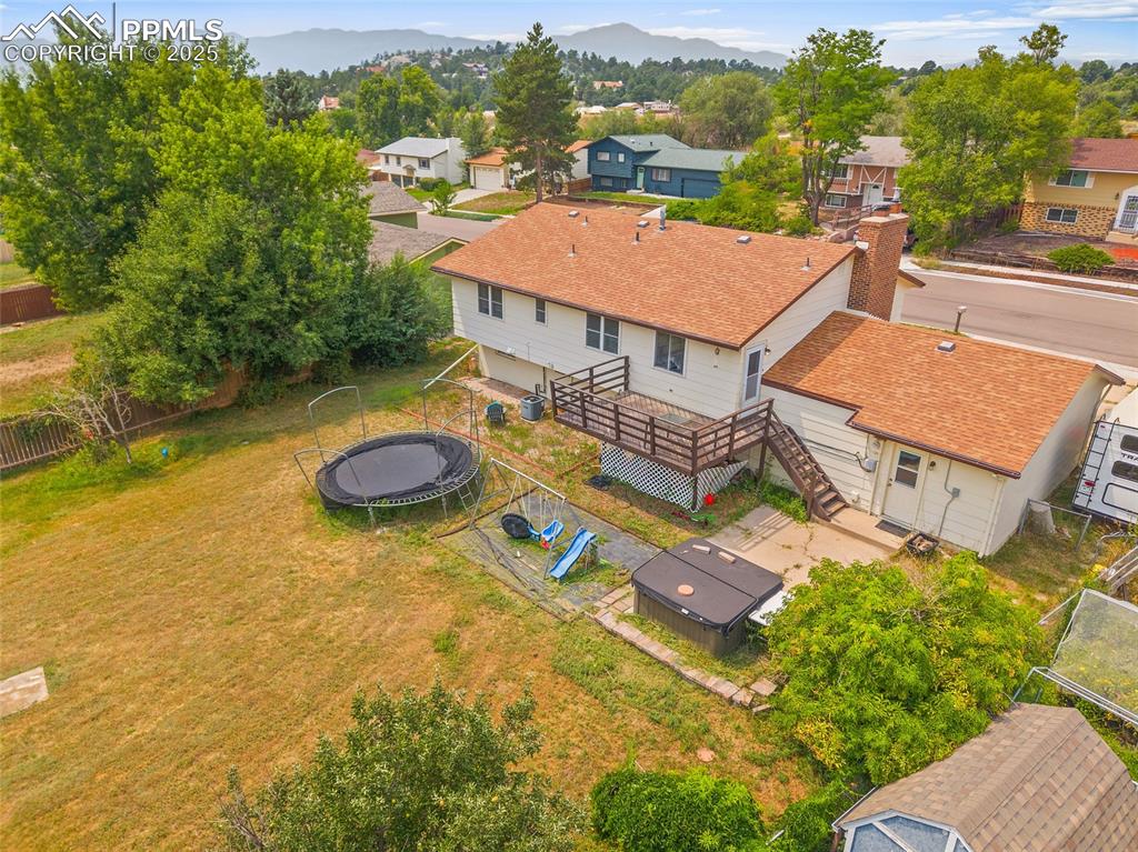 Image 38 of 49: Aerial perspective of suburban area featuring mountains