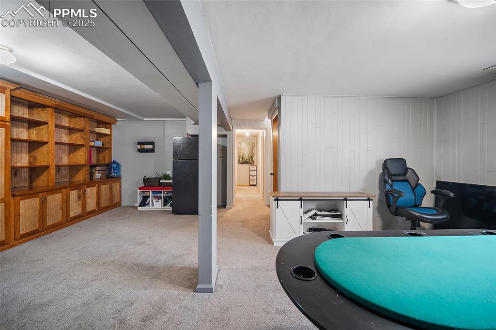 Image 9 of 49: Exercise area featuring light colored carpet