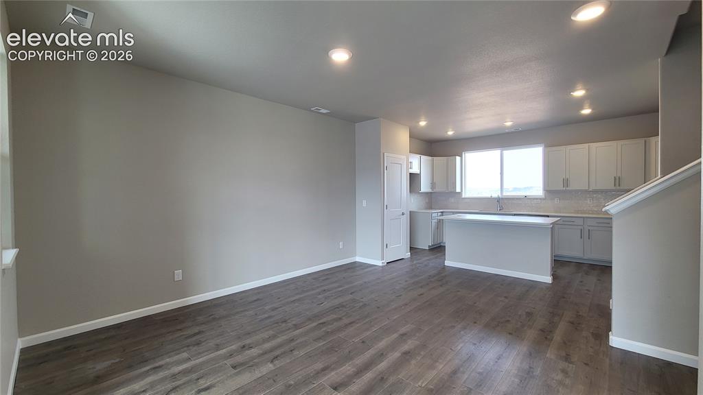 Image 12 of 28: Dining area with LVP flooring, ready to host!