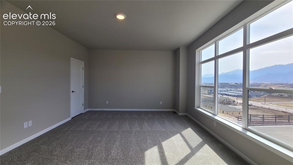 Image 18 of 28: Primary Suite is accompanied with a private deck, plush bathroom, and walk-