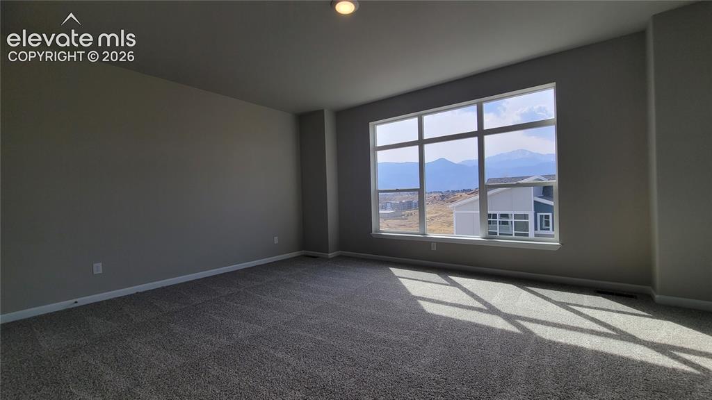 Image 19 of 28: Primary Suite is accompanied with a private deck, plush bathroom, and walk-