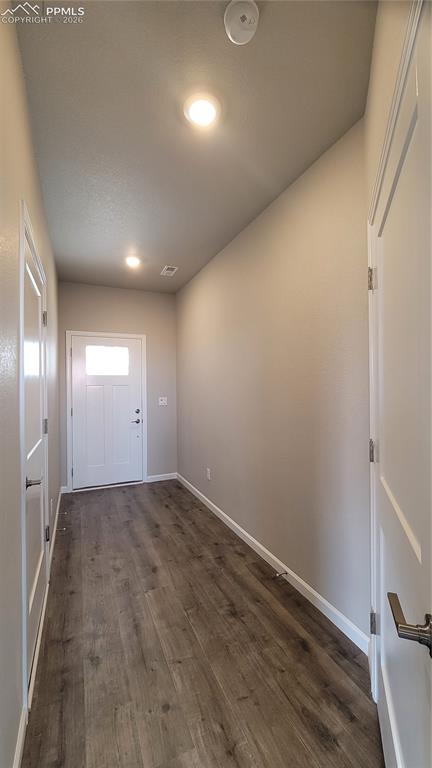 Image 3 of 28: Welcome Home! Inviting Entryway with LVP flooring and garage access!